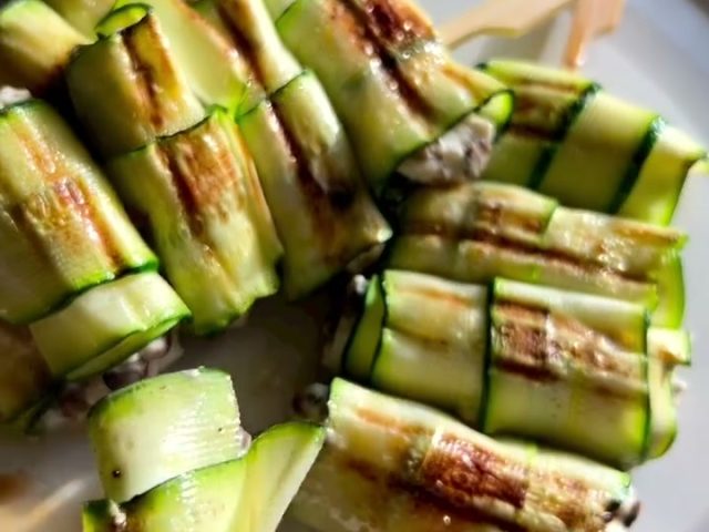 Grilled zucchini rolls on skewers