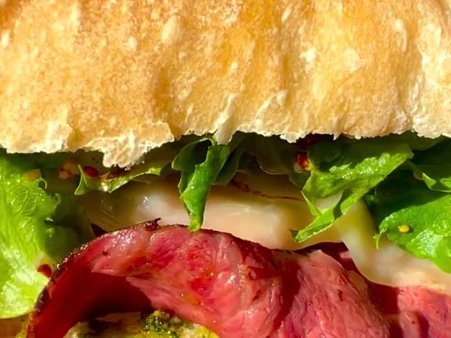 Pastrami sandwich with pistachio pesto on freshly baked ciabatta